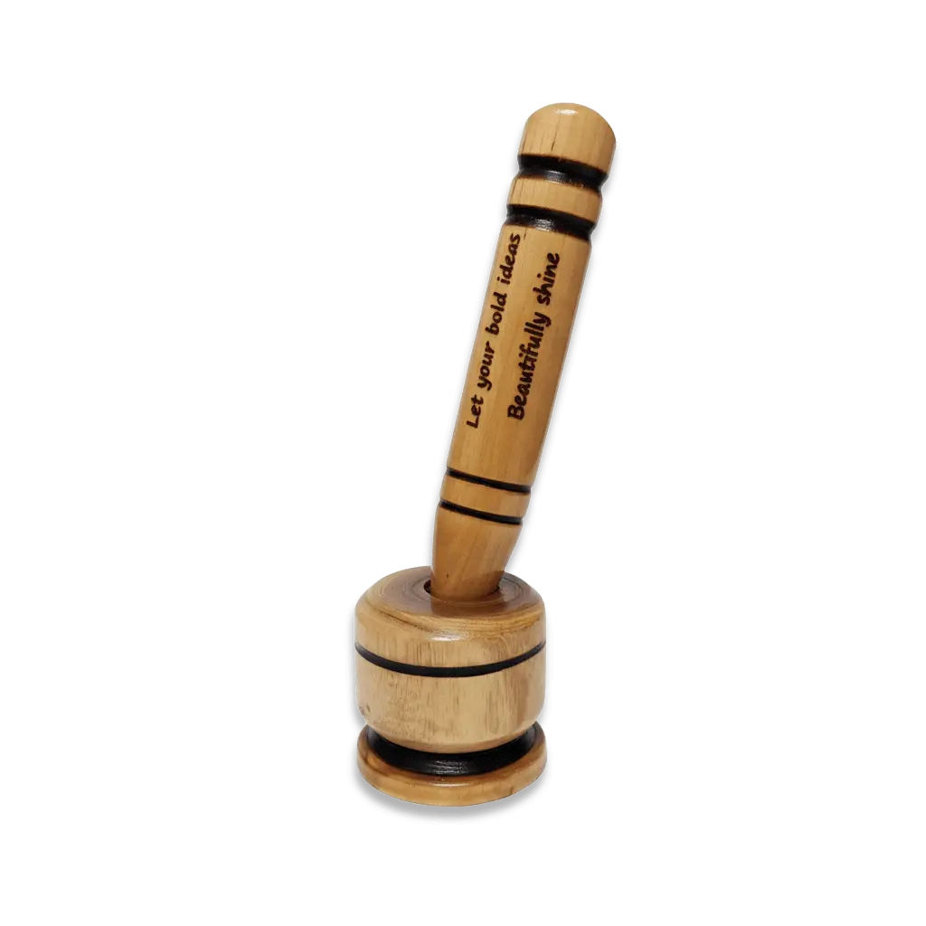 A large wooden pen resting in a round wooden stand featuring the laser-engraved motivational quote "Let your bold ideas Beautifully shine"